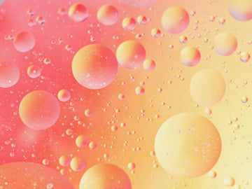 Colorful yellow bubbles on a gradient background for Liposuction description